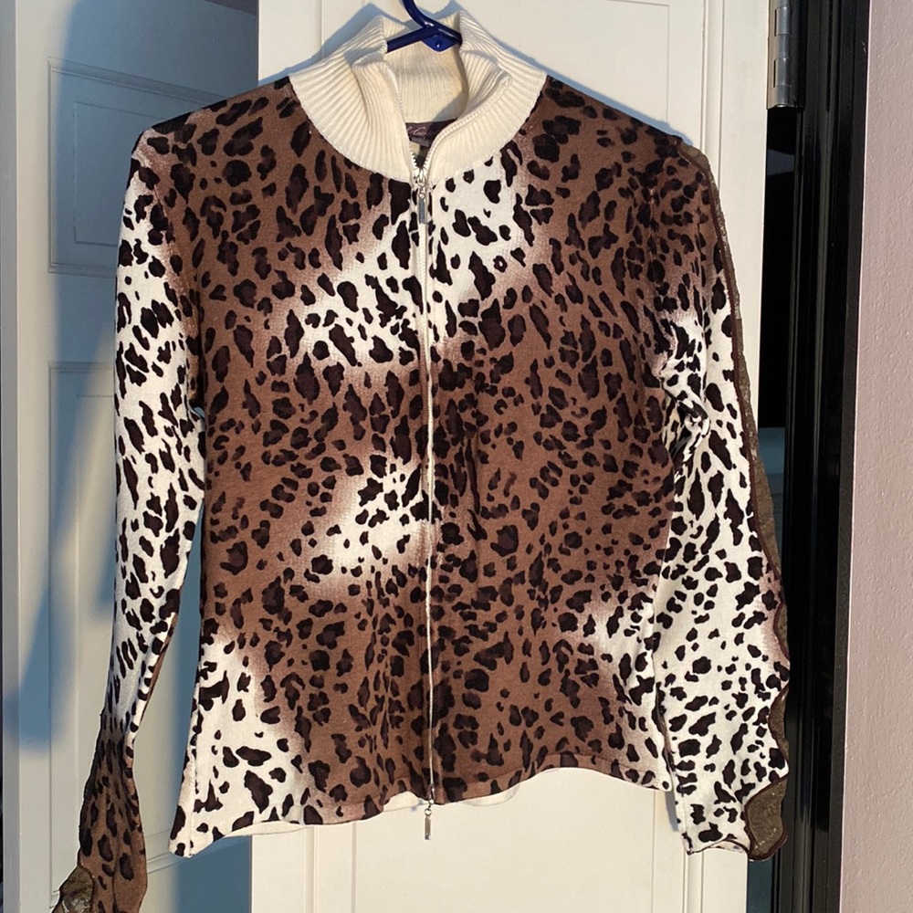Metric animal print zipper front sweater.